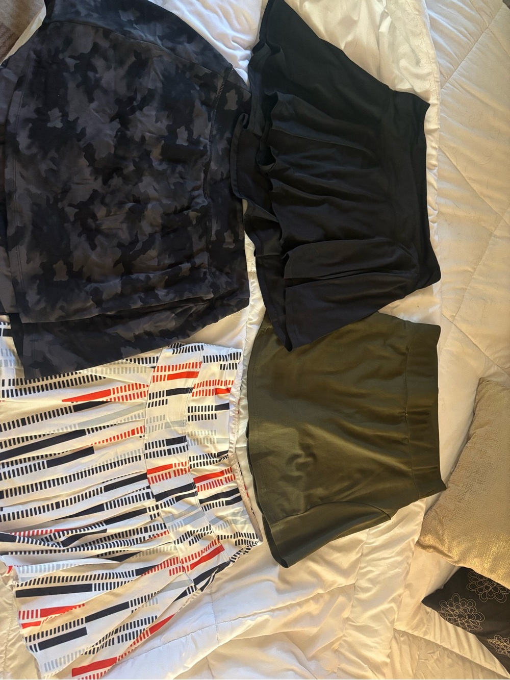 Bundle of 4 tennis/pickleball skirts. All with built in ball shorts. Pockets.